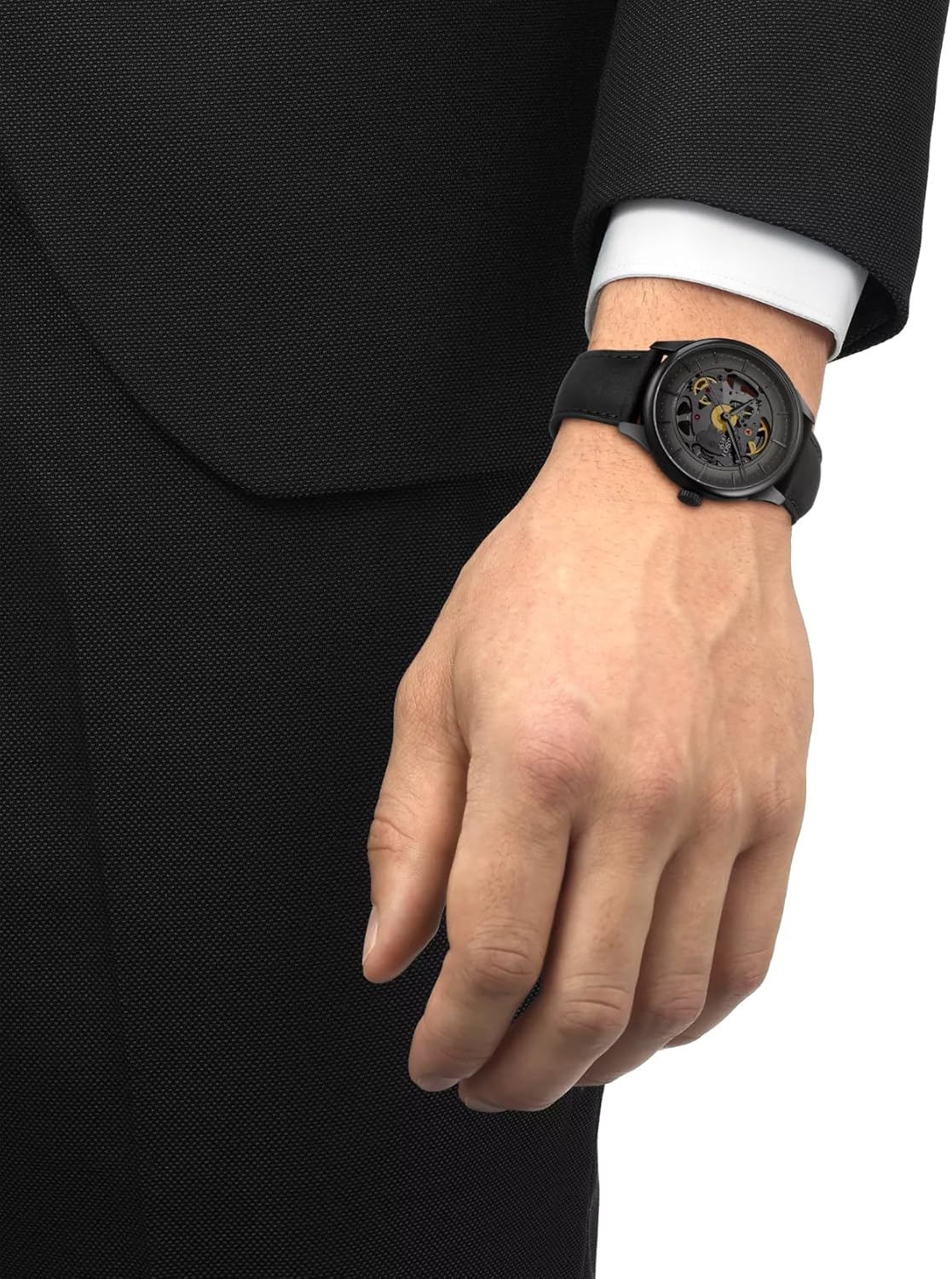 Silver stainless steel skeleton watch with transparent dial and polished case — front