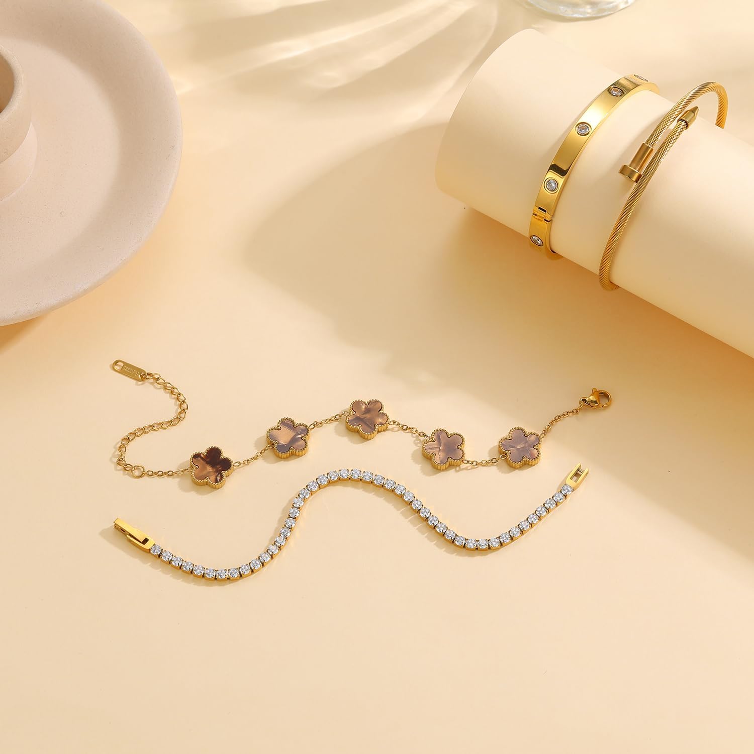 gold-plated bangle bracelet stack with floral clover and crystal accents, adjustable stackable design — view 4